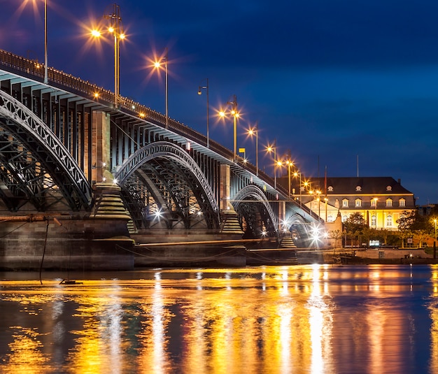 Beautiful sunset night over Rhine / Rhein river and old bridge in Mainz near Frankfurt am Main, Germany.