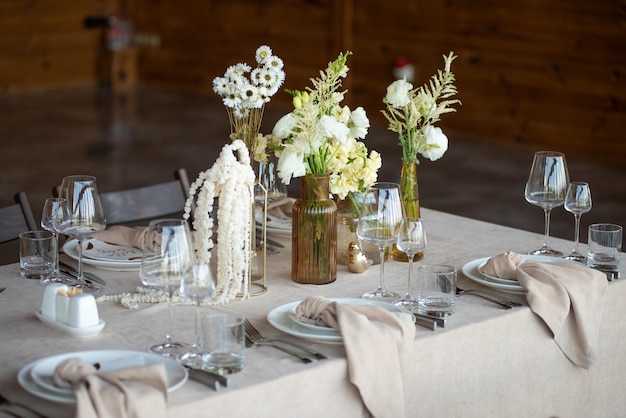 beautiful wedding table setting with candles and flowers