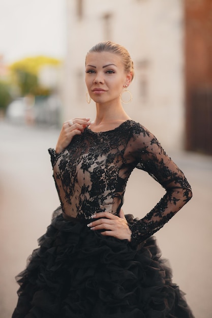 beautiful young woman in a luxurious black dress in Montenegro