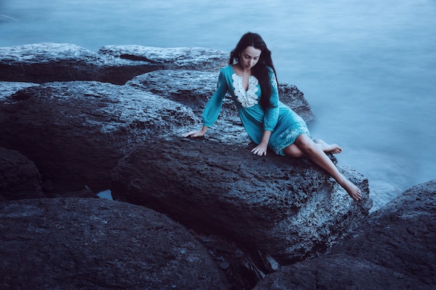 Beautiful young woman on sea