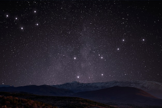 Beeautiful landscape with mountain and starry sky