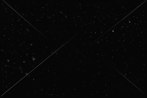 Photo a black background with stars and snowflakes