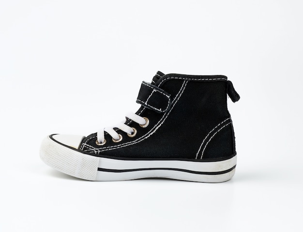 Black textile sneaker with white tied shoelaces