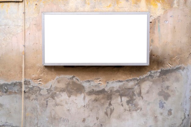 Photo blank sign template horizontal on an old cement wall outside