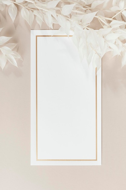 Blank white paper mockup and beige branches