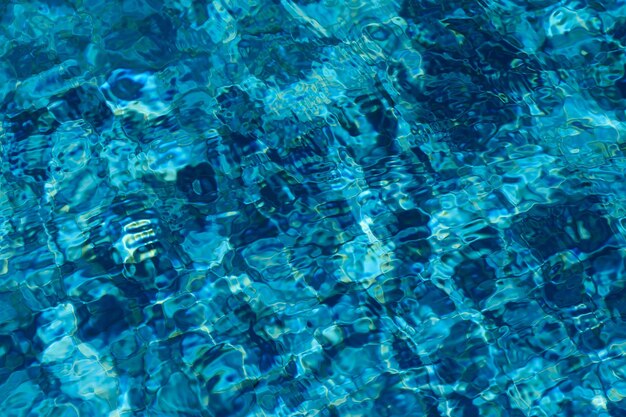 Photo blue water in swimming pool background