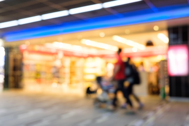 Blurred scene customer walk into beauty store light decoration