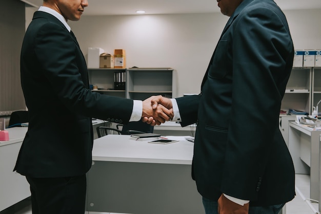 Business people shaking hands finishing up a meetingNegotiations were successfully