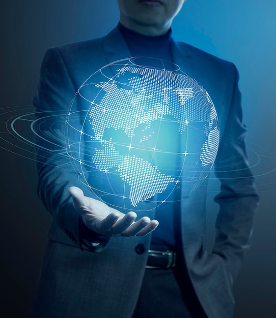 Photo businessman holding a modern virtual digital globe in his hand in concept of great potentail of handling things or business information