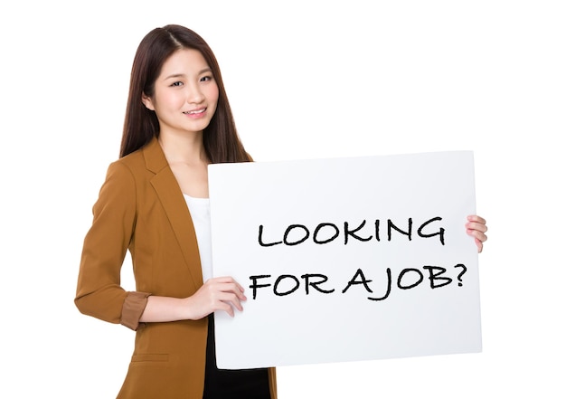 Photo businesswoman hold with palcard and presenting phrase of looking for a job