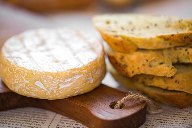 Camembert on board. Cheese for advertising. A piece of blue cheese. Bree from the oven.Cheese baked