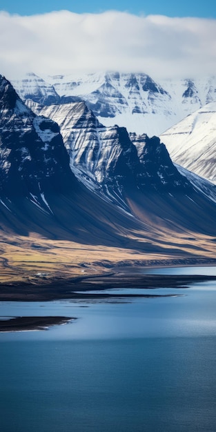 Capturing The Essence Of Nature A Stunning Mountain Range With A Frozen Lake