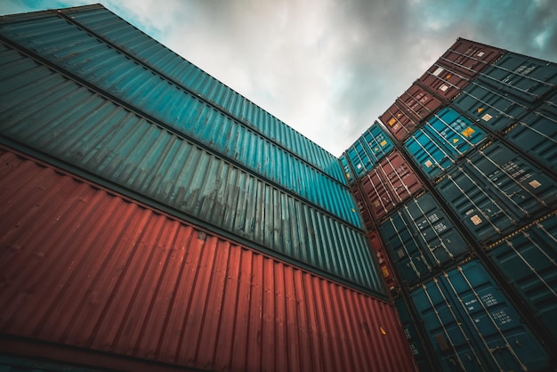 Cargo container for overseas shipping on high stack look up from ground