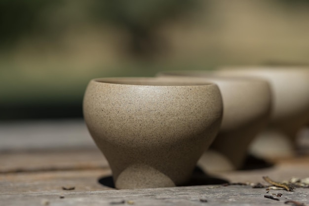 Ceramic bowls made of clay on a wooden background