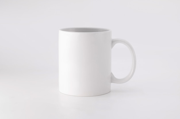 Photo ceramic mug on white background. blank drink cup for your design.