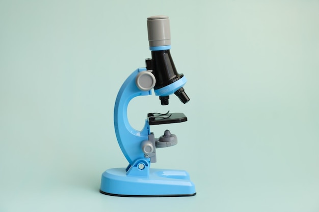 Photo children's toy microscope on a light blue background