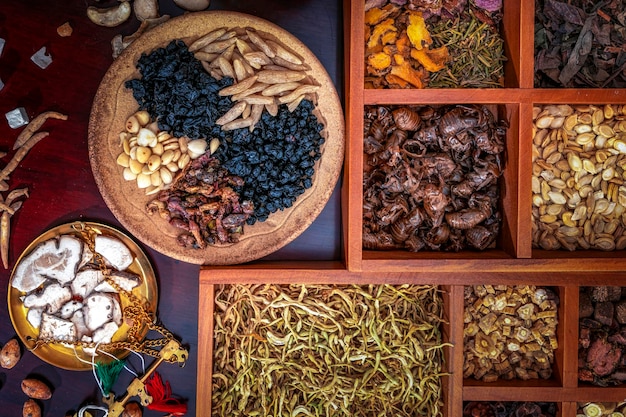 Chinese herbal medicine and flower tea on wooden