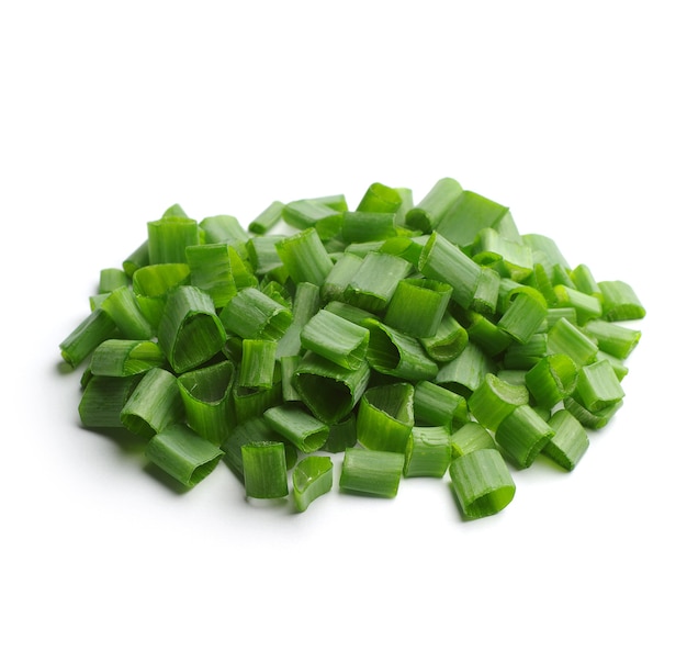 Chopped spring onions closeup on a white background