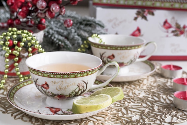 Christmas composition with flowers and white tea cups