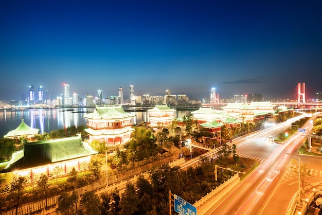 Cityscape and skyline of downtown near water of chongqing at night