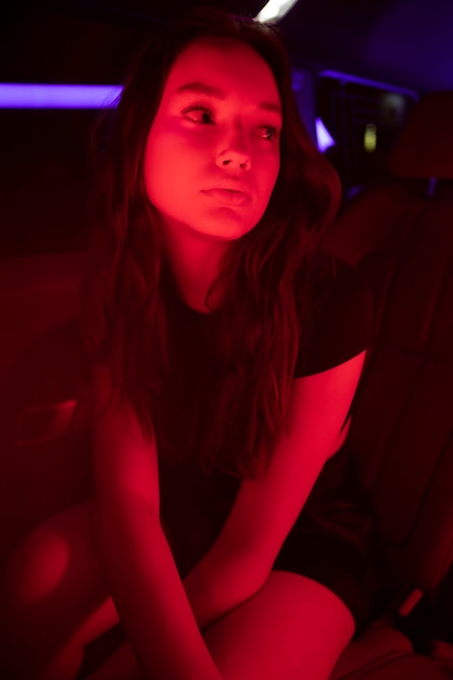 Close up on beautiful young woman inside car