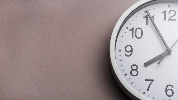 Close-up of clock face against gray background