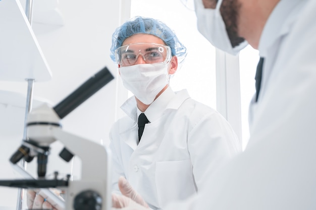 Close up. group of scientists discussing the results of testing.