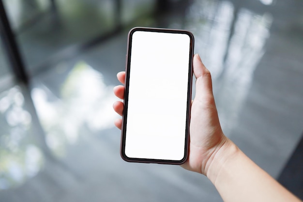 Photo close-up of hand holding smart phone