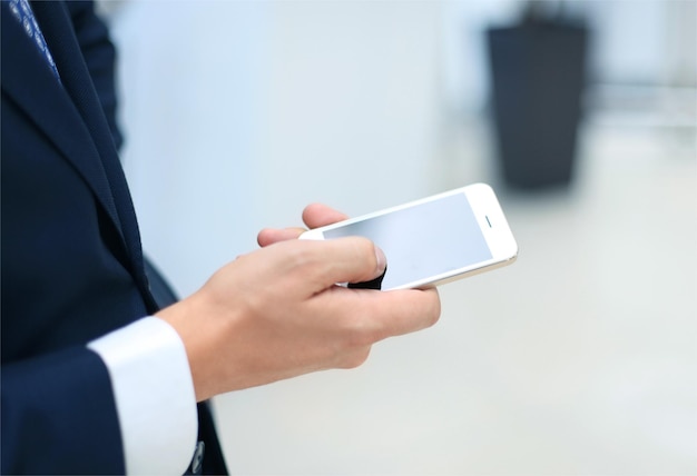 Close up of a man using mobile smart phone