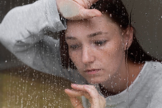 Close up sad woman with rain