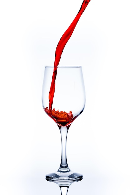 Photo close-up of wineglass on glass against white background