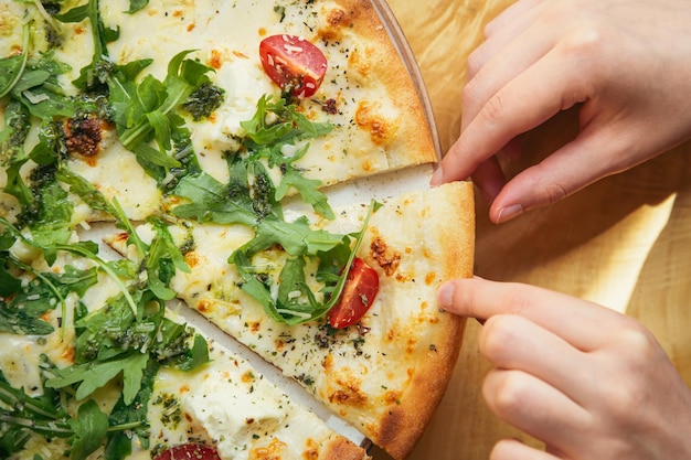 Closeup vegetable vegetarian pizza on a wooden table top view