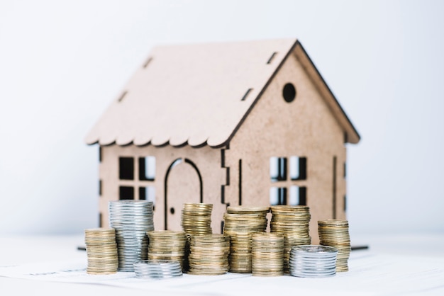 Coins in front of house