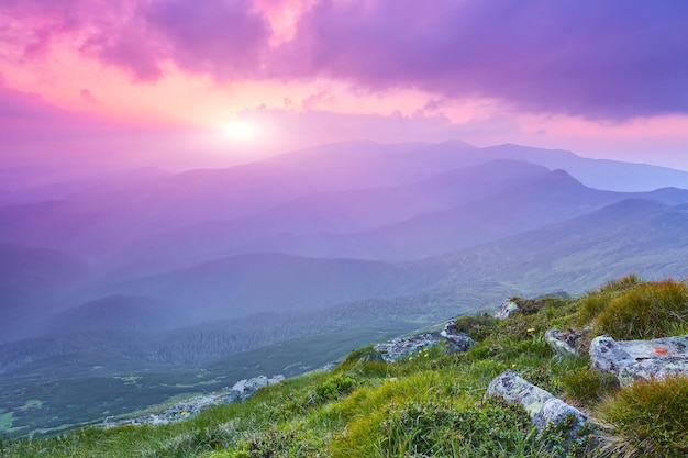 Colorful summer sunset in mountains