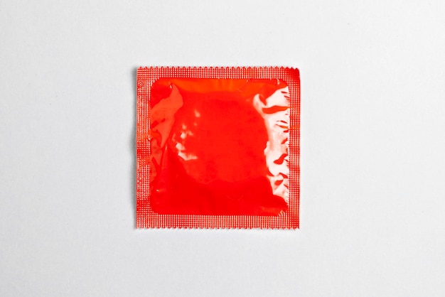 Photo condom lie on a yellow background the concept of safe sex