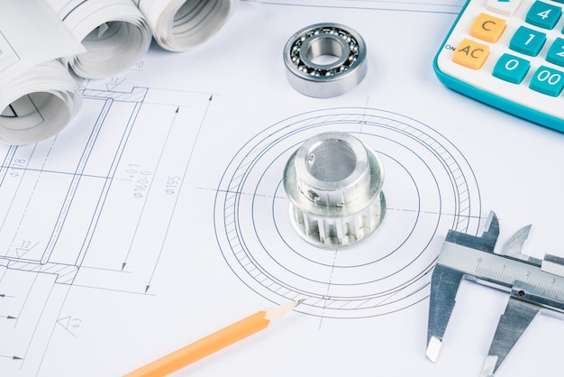 Construction drawings slide caliper roller bearings on blueprint architecture and building concept.