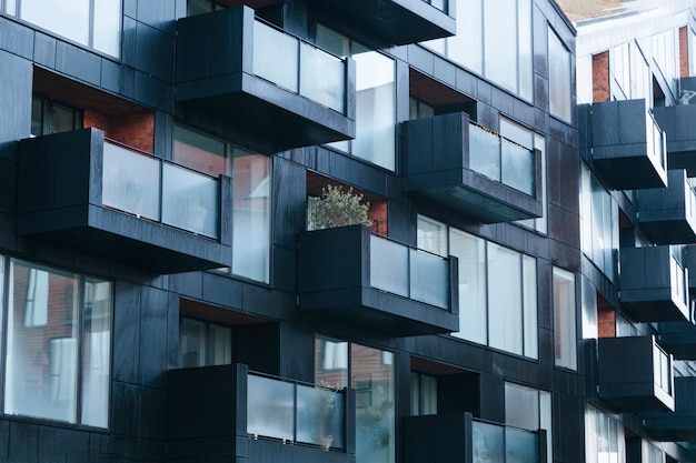 Contemporary black building exterior wit balconies