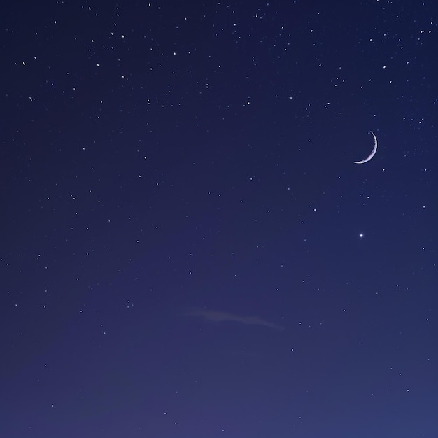 Photo crescent moon and stars in the night sky