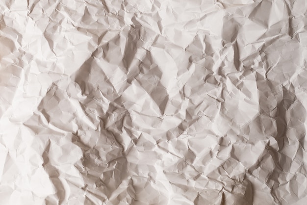 Crumpled white paper background.