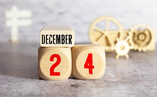 Photo cube with text from numbers and a month december 24 the end of the year and summing up