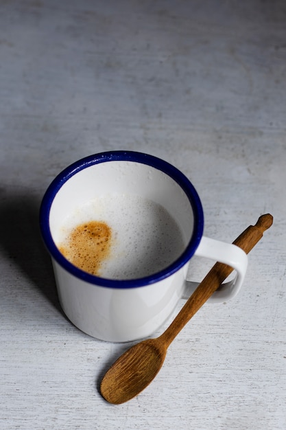 Cup of coffee on white table