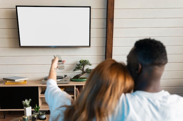 Cute couple watching a movie on streaming service