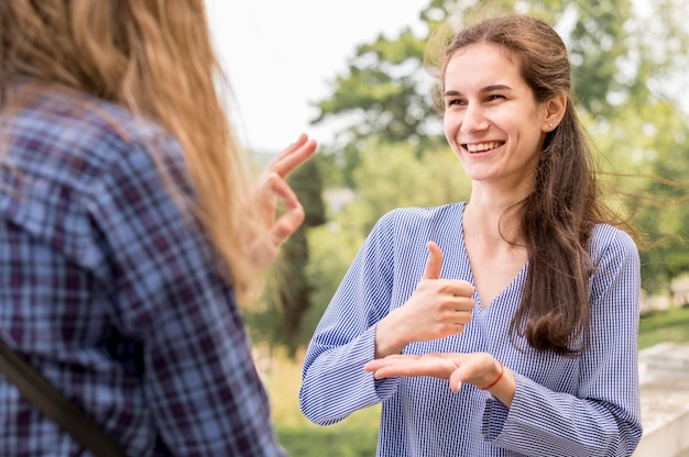 Deaf woman communicating through sign language