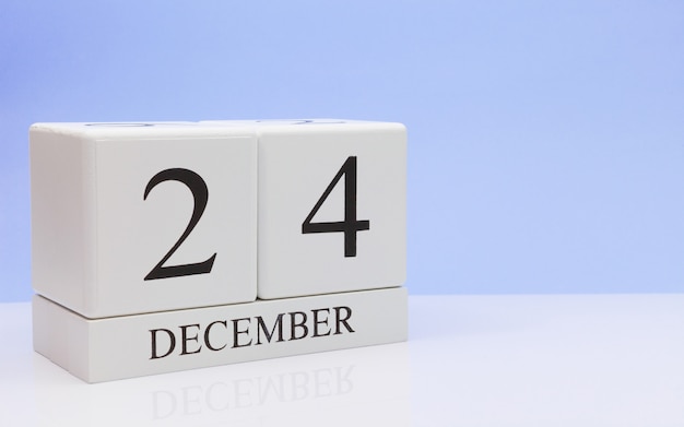 Photo december 24st. day 24 of month, daily calendar on white table.