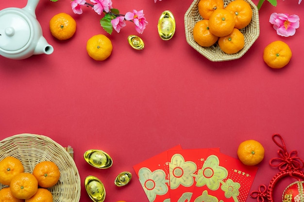 Directly above shot of fruits in container by decoration over pink background