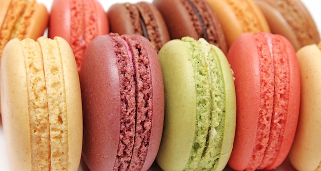 A display of colorful macaroons with one that says macaroons.