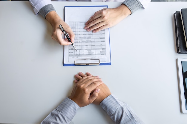 Doctor and patient are discussing consultation about symptom problem diagnosis of disease talk to the patient about medication and treatment method