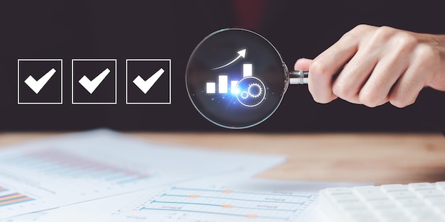 Photo document review and analyze statistics and graphs of business growth