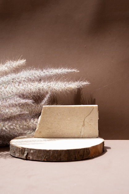 Dry grass styled stock scene in rich brown earth tones, travertine podium display with copy space