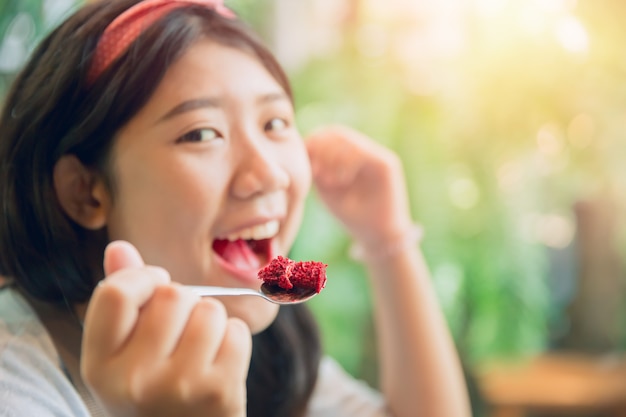 Eating cake. cute asian young pritty tubby women eat dessert in cafe.